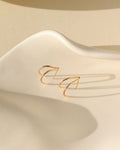 14k gold fill stud earrings on a light dish